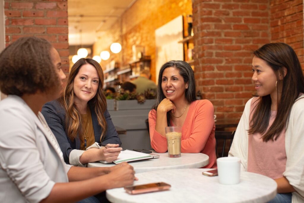 Group of women sitting around table