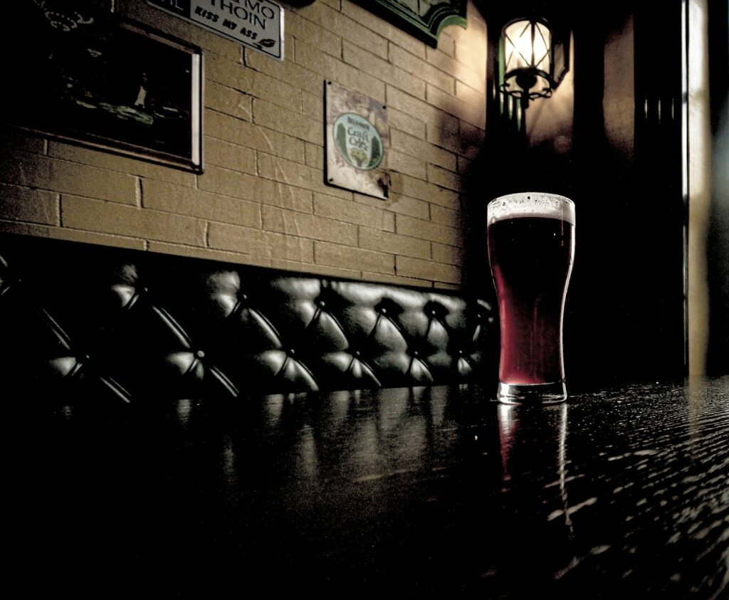 a glass of beer on a table