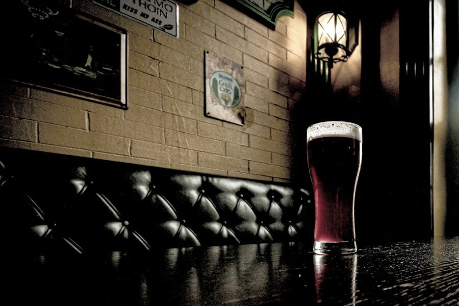 a glass of beer on a table