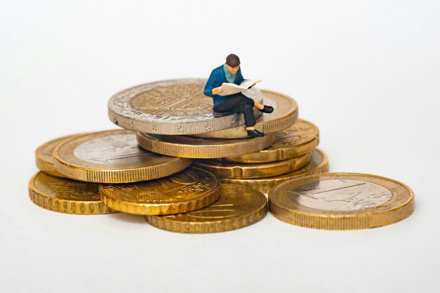 Man sitting on pile of money