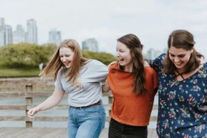 Three women laughing together