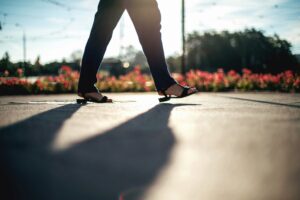 Woman walking on pavement