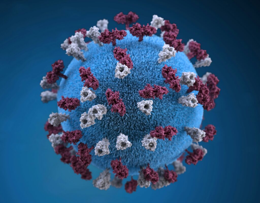 Illustration of a spherical virus with a blue core, reminiscent of grime-covered dirty office items, adorned with red and white spike proteins on a blue background.