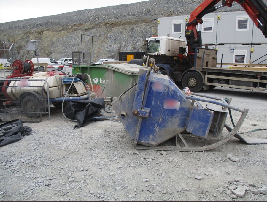 An overturned skip at a construction site.