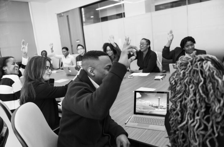 People of different ethnic groups at a work meeting.