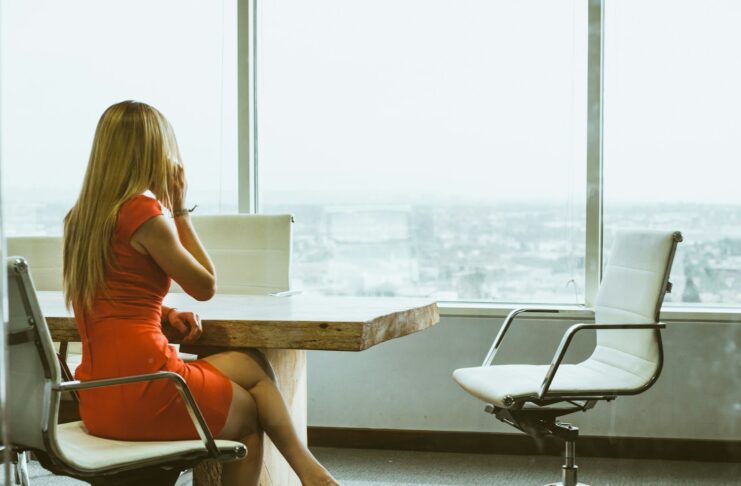 A woman sitting in an office chair.