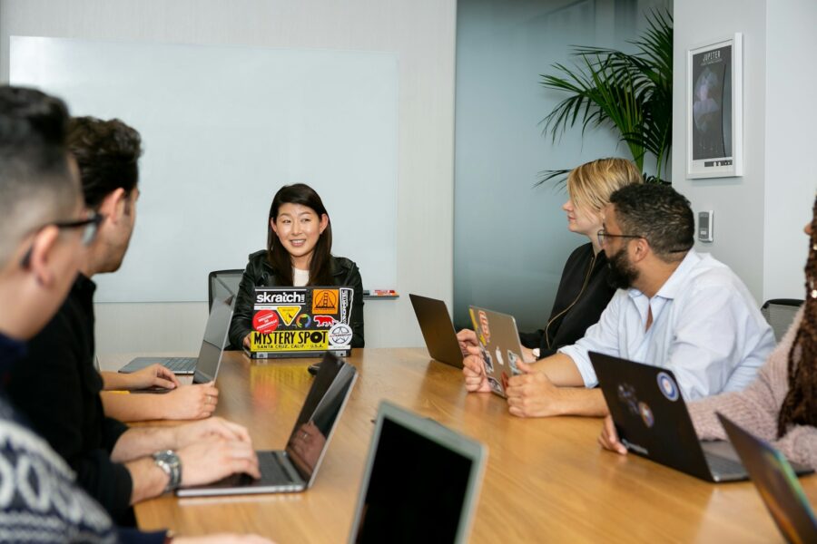 Men and a woman at a meeting.