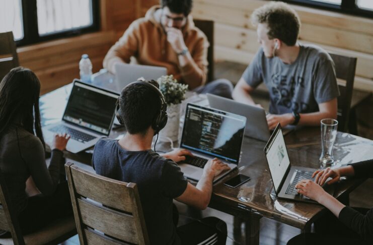 A group of people using laptop computers