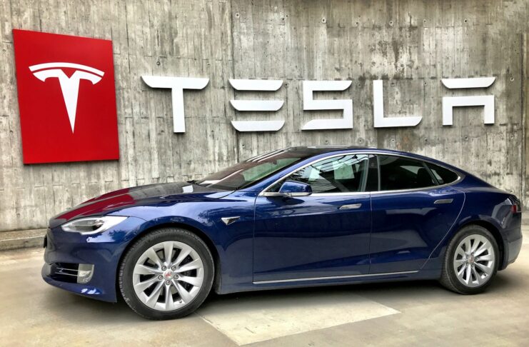 A navy Tesla car.