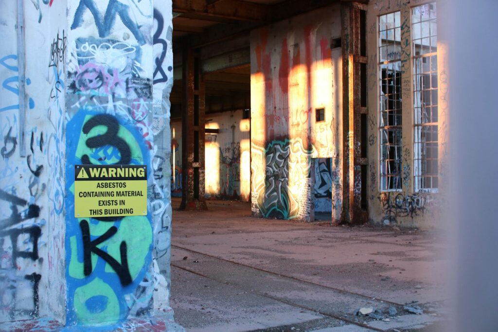 A building with an asbestos warning sign.