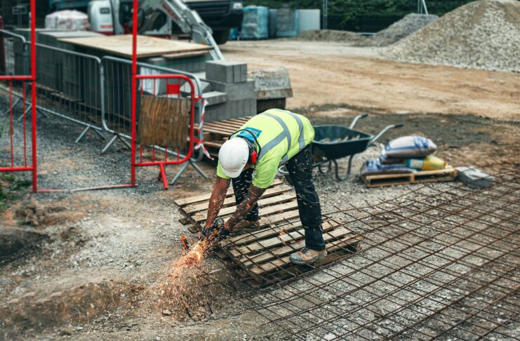 A man works at a construction site.