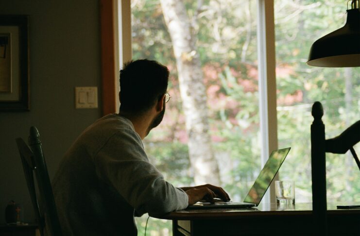 A man working from home on a laptop.