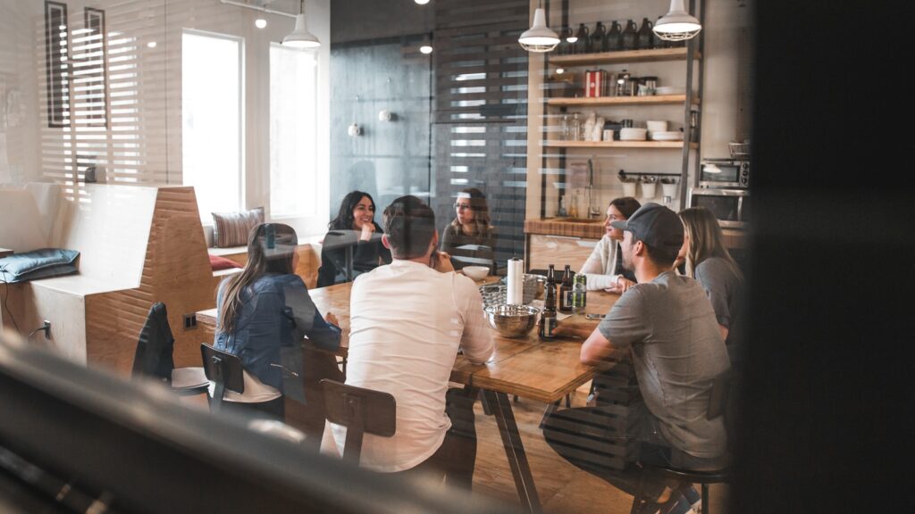 People gathered around a table in an office setting.