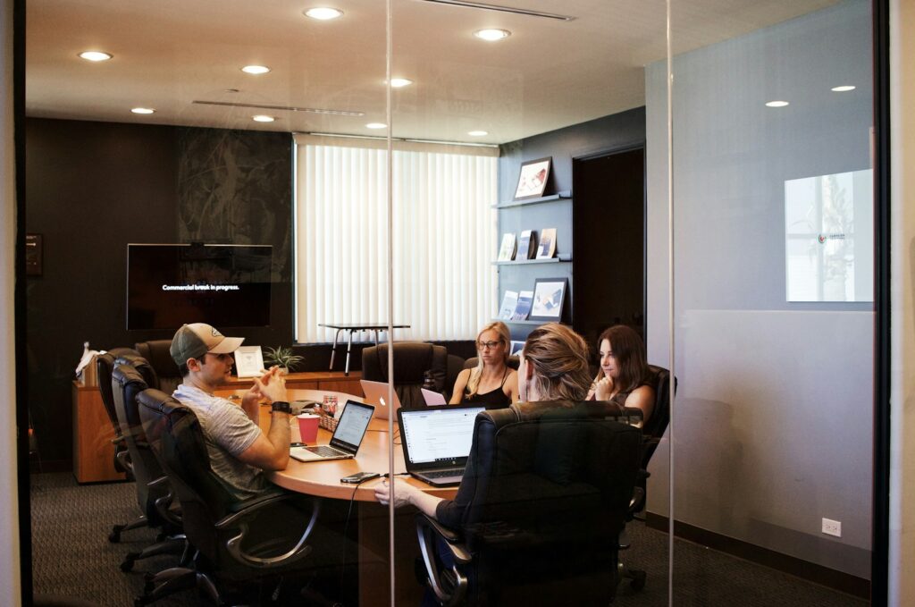 People having a meeting around a table in an office.