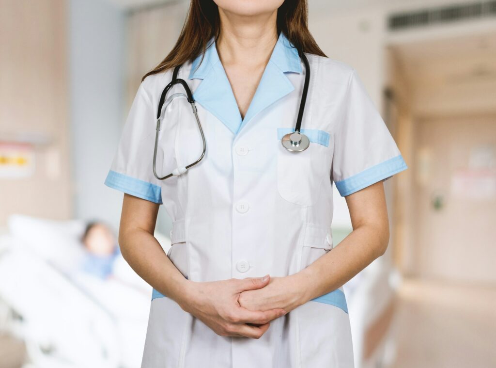 A nurse with a stethoscope around her neck.