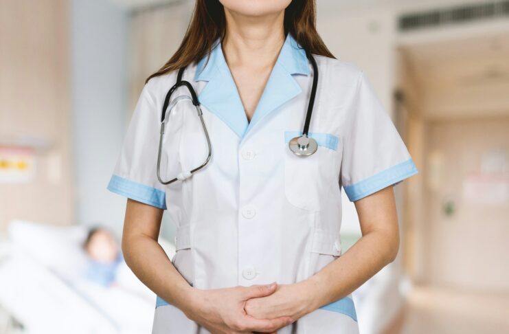 A nurse with a stethoscope around her neck.