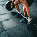 Stronger Staff, Healthier Business: Why Employers Should Champion Strength Training A person doing deadlifts.