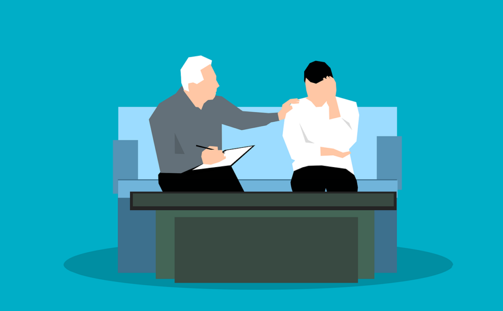 A man talking to another, who appears to be disengaged.