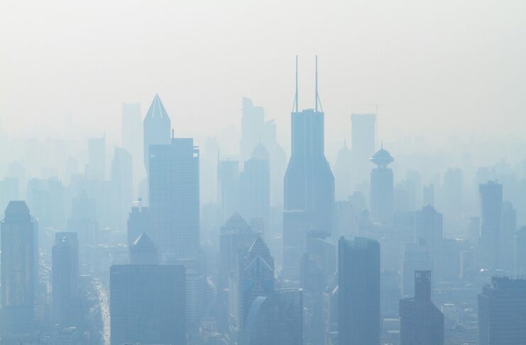Photo by Photoholgic Air pollution surrounding a city.