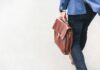Nearly Half of Private Equity Talent ‘Considering Leaving Over Lack of Inclusion’ person walking holding brown leather bag
