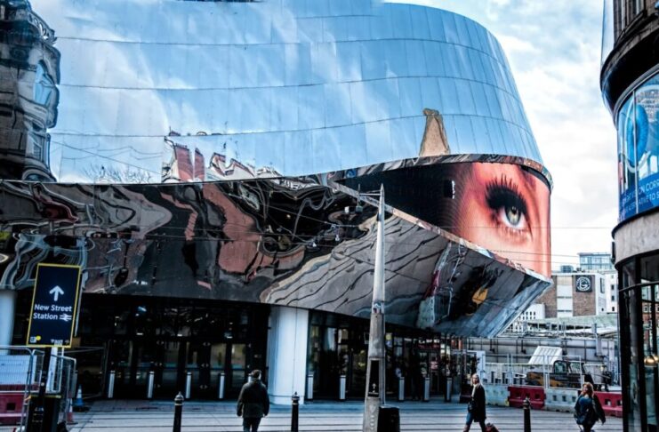 people walking near glass building during daytime