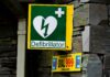 One in Seven Cardiac Arrests Happen at Work – but 65% Can’t Use a Defibrillator a green and yellow sign with a heart on it