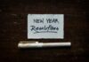 Encouraging Employee Benefits Use to Support New Year Wellbeing Goals white printer paper on brown wooden table