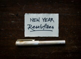 Encouraging Employee Benefits Use to Support New Year Wellbeing Goals white printer paper on brown wooden table