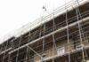 Construction Firms Fined After Worker Suffers Life-Changing Fall A building with scaffolding.
