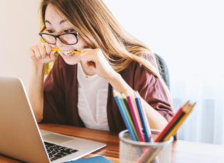 Stress Named Top Workplace Safety Issue By 61% of UK Workers A stressed-looking woman working on a laptop.