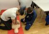Employers Warned Over Gaps in Workplace First Aid And Mental Health Training Two people do first aid training on a dummy.