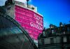 Glasgow Tops UK Cities for Tech Professionals as Regional Hubs Gain Ground low angle view of building with People make Glasgow billboard