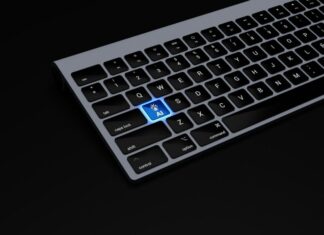 Nearly Half Of Employees ‘Fear AI Impact’ As HR Leaders Underestimate Anxiety a black keyboard with a blue button on it