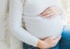 Pregnancy Discrimination Claims Rise as Workplace Decisions Face Scrutiny woman in white long sleeve shirt